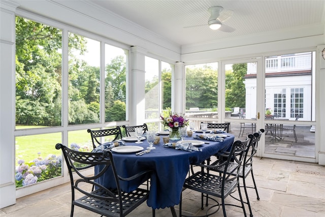 sunroom / solarium with ceiling fan and plenty of natural light