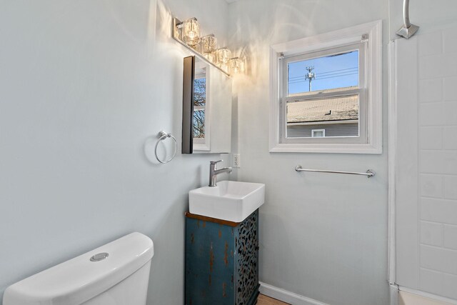29 Thompson St, Port Jervis, NY 12771 - bathroom with baseboards, toilet, a shower, and vanity