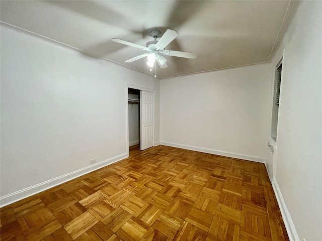 unfurnished bedroom featuring ceiling fan and light parquet flooring