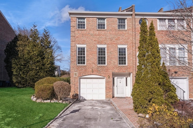 79 Marjorie Ct, Manhasset, NY 11030 - view of front of house with driveway, an attached garage, brick siding, and a front yard