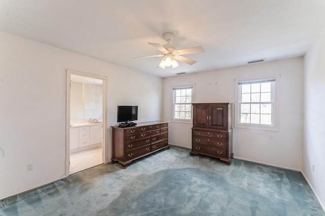 79 Marjorie Ct, Manhasset, NY 11030 - carpeted bedroom featuring connected bathroom and a ceiling fan