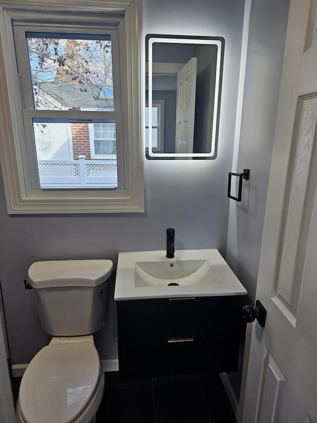 bathroom featuring vanity and toilet