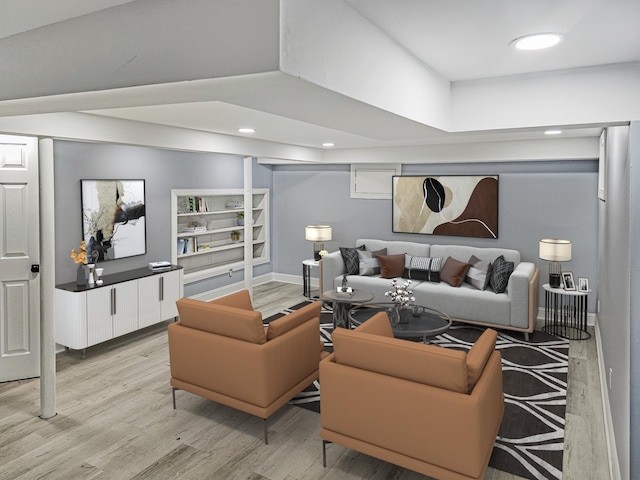 living room featuring light hardwood / wood-style floors and built in features