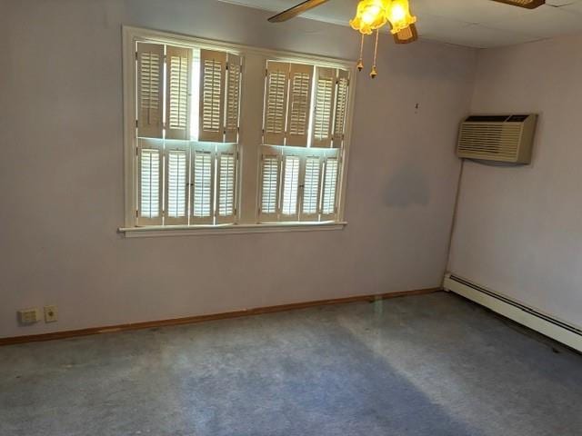 unfurnished room featuring ceiling fan, carpet floors, a wall mounted AC, and a baseboard heating unit