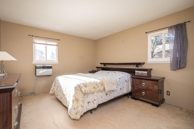 carpeted bedroom featuring an AC wall unit