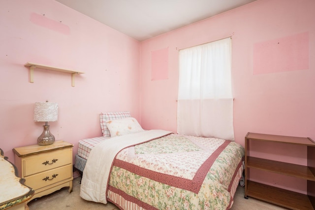 bedroom featuring light colored carpet