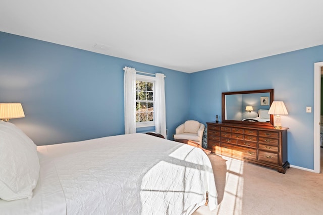 bedroom featuring light colored carpet