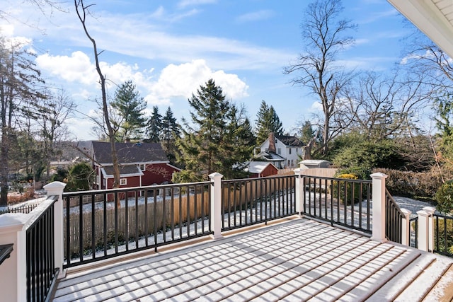 wooden deck featuring a storage shed