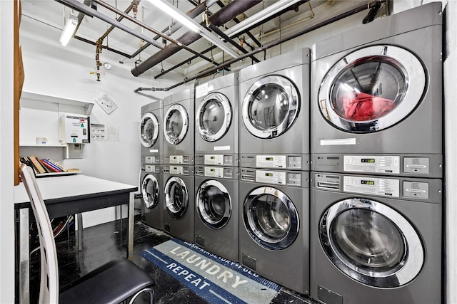 clothes washing area featuring washing machine and clothes dryer and stacked washing maching and dryer