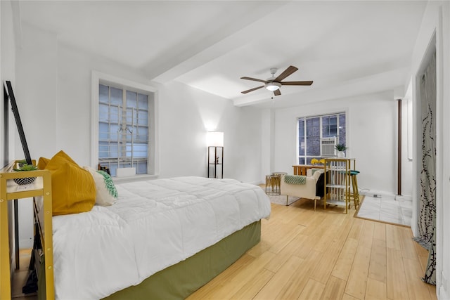 bedroom featuring ceiling fan and wood finished floors