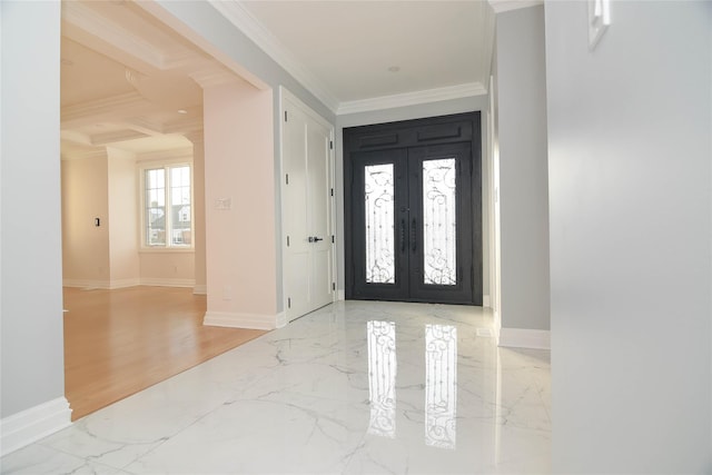 foyer featuring french doors, crown molding, and light wood-type flooring