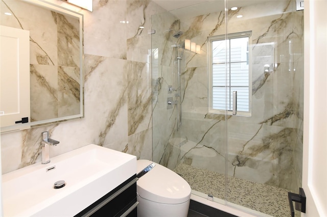 bathroom with tasteful backsplash, vanity, toilet, and a shower with door