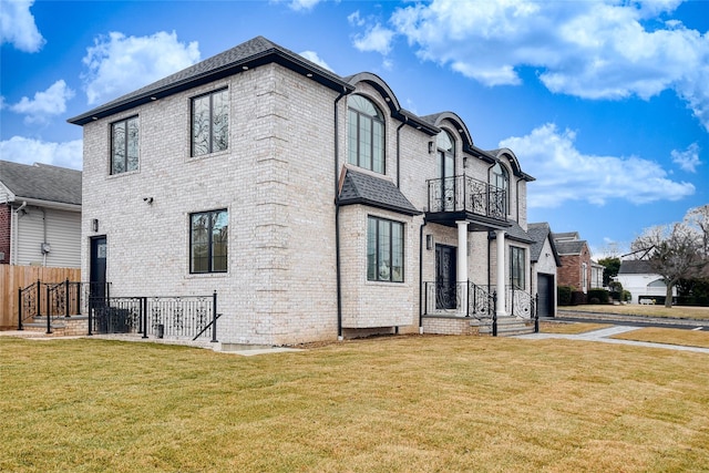 rear view of property with a yard