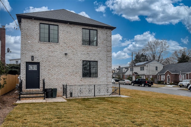 view of front of house with a front lawn