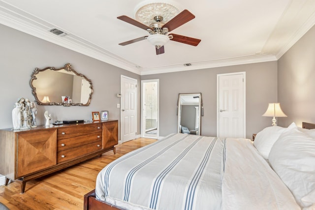 bedroom featuring hardwood / wood-style flooring, ceiling fan, and crown molding