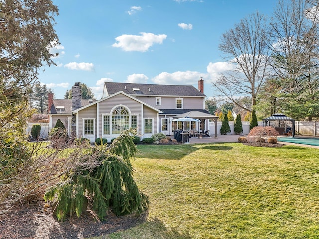 exterior space with a gazebo, a patio area, and a yard