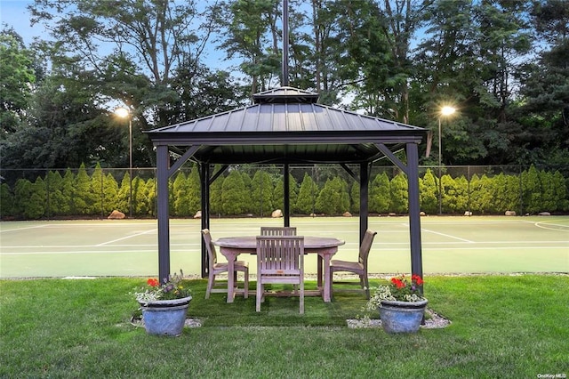 surrounding community featuring a gazebo, basketball court, and a lawn