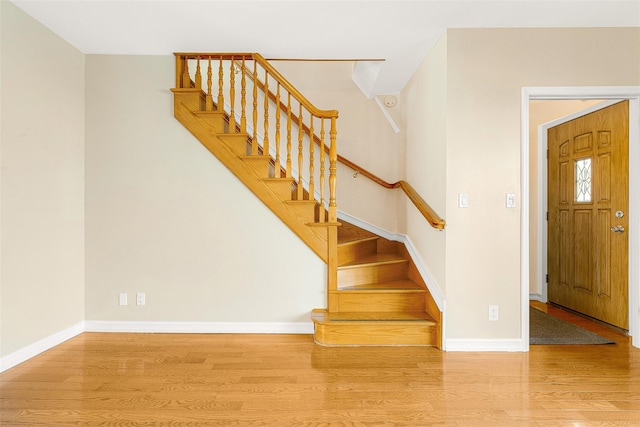 foyer entrance with hardwood / wood-style flooring