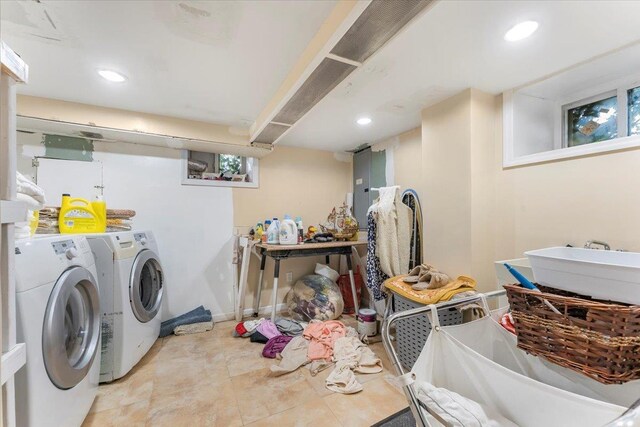 laundry area featuring electric panel and washer and dryer