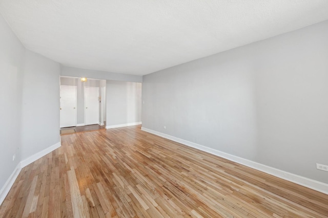 spare room featuring light wood-type flooring