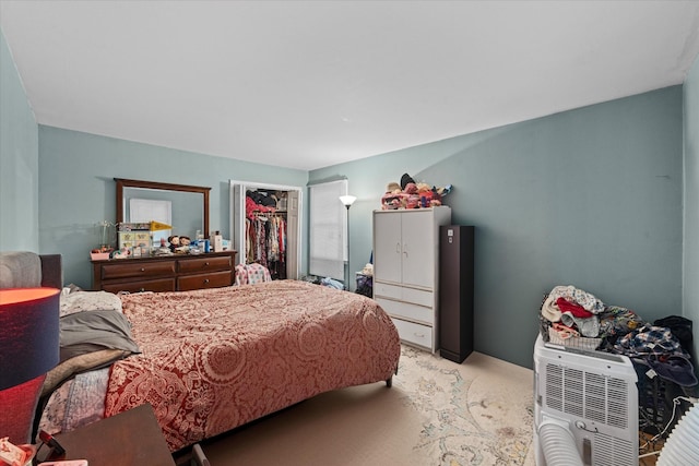 bedroom featuring a walk in closet and a closet