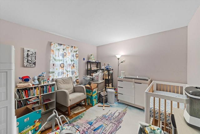 bedroom featuring a crib