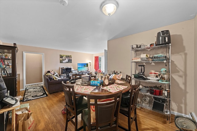 dining room with hardwood / wood-style floors