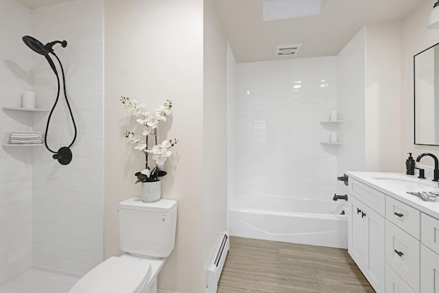 full bathroom with shower / tub combination, vanity, a baseboard radiator, and toilet