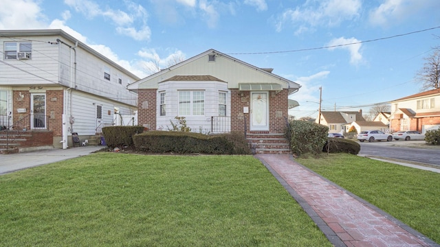 bungalow with a front yard