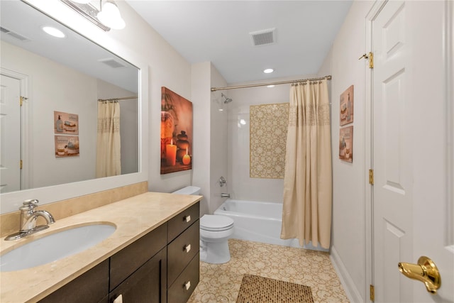 full bathroom with tile patterned floors, shower / tub combo with curtain, vanity, and toilet