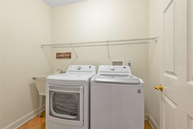 laundry room featuring washer and clothes dryer