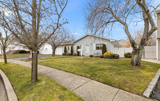 ranch-style house featuring a front lawn