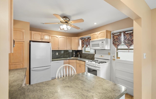 kitchen featuring light brown cabinets, white appliances, ceiling fan, tasteful backsplash, and kitchen peninsula