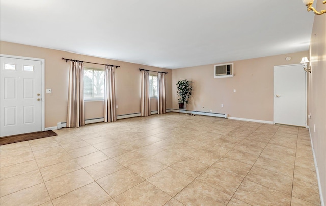 spare room featuring light tile patterned flooring and a baseboard heating unit