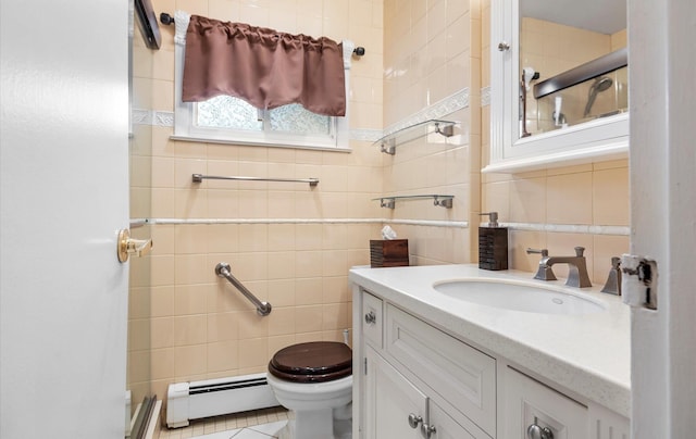 bathroom featuring tile walls, toilet, decorative backsplash, vanity, and baseboard heating