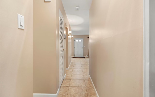 hallway featuring light tile patterned floors