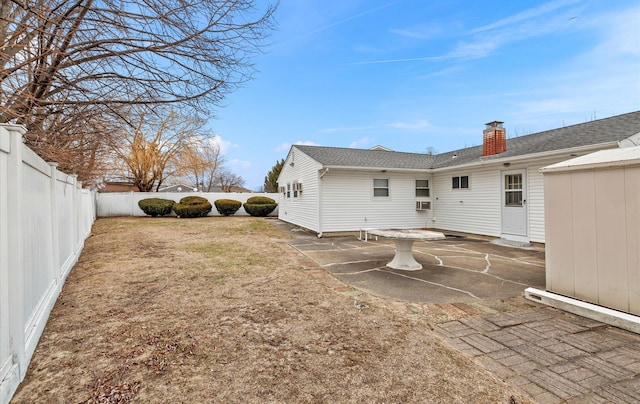 rear view of property with a patio area