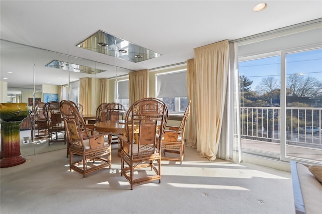 dining room with light colored carpet