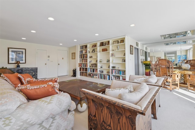 carpeted living room with built in features