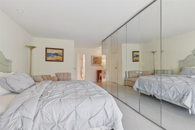 bedroom with light colored carpet