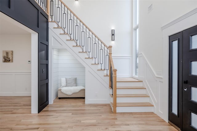 stairway with hardwood / wood-style floors