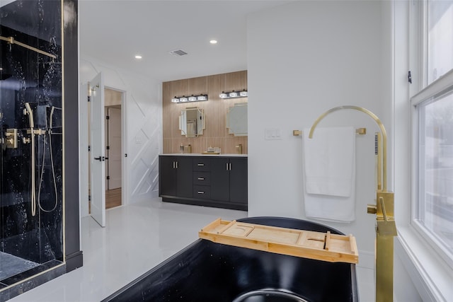 bathroom with a shower, vanity, and decorative backsplash