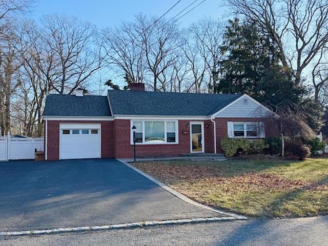 single story home featuring a garage