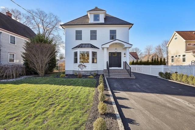 view of front of home with a front yard