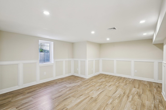 unfurnished room featuring light hardwood / wood-style flooring