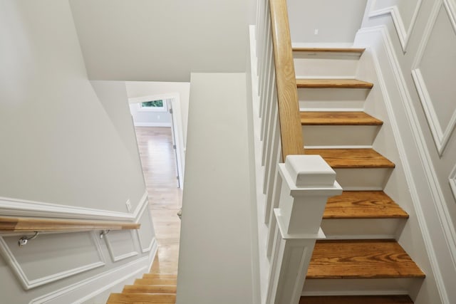 staircase featuring hardwood / wood-style floors