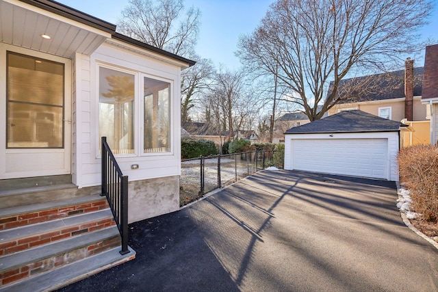 exterior space featuring an outdoor structure and a garage