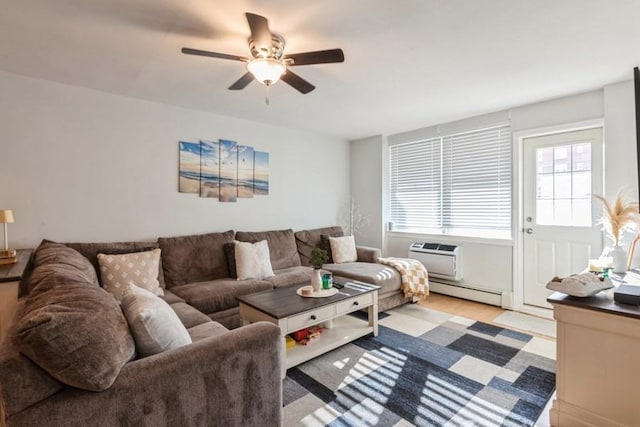 living room featuring a wall mounted AC, a baseboard radiator, and ceiling fan