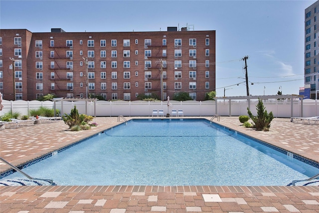 view of swimming pool with a patio