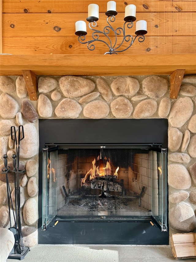 interior details with a stone fireplace